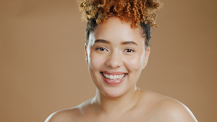 Image showing Woman in portrait, natural beauty and happy with cosmetics and skin glow isolated on brown background. Dermatology, wellness with skincare and face with smile, self care and anti aging in studio