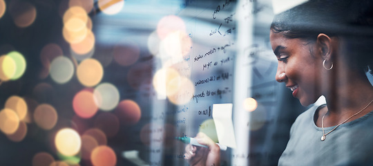 Image showing Happy woman, writing and schedule planning at night on glass board for strategy or ideas at office on bokeh background. Female person smile working late on project plan, tasks or agenda at workplace