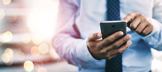 Image showing Businessman, phone and hands typing for communication or networking on bokeh background at office. Closeup of man on mobile smartphone app for online texting, chatting or social media and research