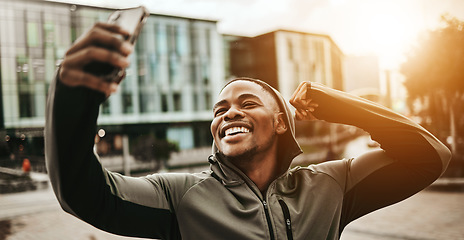 Image showing Happy black man, city and selfie for fitness or photography after running, training or exercise. Active African male person smile and flexing for sports photograph, picture or memory in an urban town