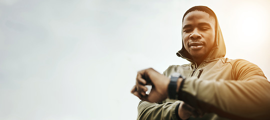 Image showing Black man, smart watch and monitor for fitness, training or exercise schedule with bokeh for personal trainer. Athlete, person and stopwatch or timer for performance update or results for wellness