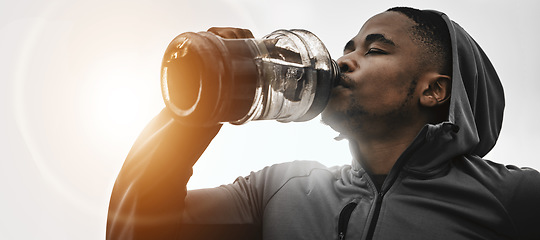 Image showing Black man, fitness and drinking water on break for hydration, workout or exercise in motivation. Banner of African male person with sports or mineral drink for natural sustainability or recovery