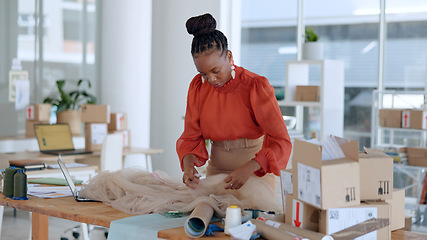 Image showing Fashion logistics, designer and black woman with box for clothing brand, texture and pattern in workshop. Retail, boutique and person with material for creative startup, small business and store