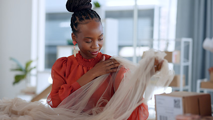 Image showing Fashion, designer and black woman with fabric for logistics clothing brand and textures in workshop. Retail, delivery and person check material for creative startup, small business and boutique