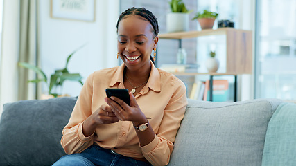 Image showing Happy black woman, phone and social media on sofa in relax, communication or networking at home. African female person smile, laughing or mobile smartphone for funny joke or meme on couch in house