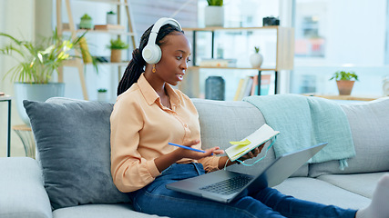 Image showing African woman, student and laptop for online course on sofa, headphones and notes with thinking in home. Girl, reading and ideas with notebook, computer or headphones for study on video call on couch