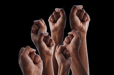 Image showing Fist, group protest and together by black background for human rights, power or solidarity for equality. People, support and strong with hands, air or change for motivation, goal or fight for justice