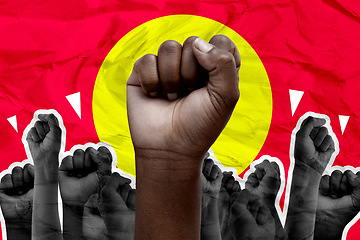 Image showing Fist, protest and fighting for human rights with people on a red background together to rally a crowd. Hands, power and equality with an adult group at a march for freedom, justice or change