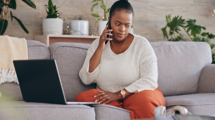 Image showing Laptop, phone call and a concerned black woman on a sofa in the living room of her home for problem solving. Computer, communication and worry with a person talking on her mobile for networking