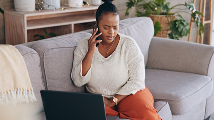 Image showing Laptop, phone call and worry with a black woman on a sofa in the living room of her home for problem solving. Computer, communication and a concerned person talking on her mobile for networking