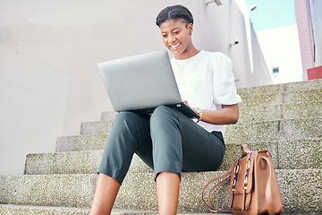 Image showing Woman, laptop and typing remote work on stairs with thinking, smile and ideas for content creation. African copywriting expert, computer and happy for vision, planning and solution for project