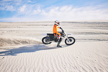 Image showing Desert dust, motorbike and man outdoor for extreme sports, adventure and travel. Off road, sand and driver on motorcycle on dirt track in nature for action, competition race and riding for freedom