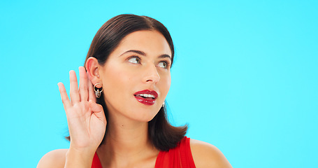 Image showing Secret, gossip and woman in blue studio background for beauty and listening. Whisper, frame and privacy with makeup, headshot and isolated for cupping ear, rumour and thinking for spy, emoji or talk