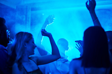 Image showing People dancing in a nightclub, crowd at a party listening to disco or social celebration of new years eve in Las Vegas. Music festival event, celebrate a night out together or techno lighting at rave
