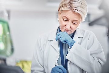 Image showing Science, research and senior woman writing notes on documents in laboratory. Innovation, thinking and elderly female scientist researching, recording and write experiment results, analysis or report.