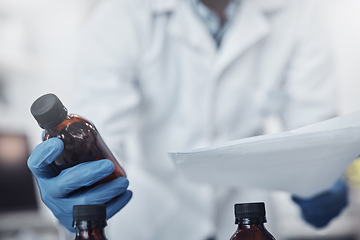 Image showing Hands, bottle and science with a doctor man at work in a laboratory for research or medical innovation. Healthcare, analytics and vaccine with a medicine professional working on development in a lab