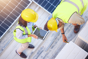 Image showing Top view, teamwork and engineers with tablet on solar roof for maintenance, inspection or installation. Solar energy, renewable energy and man and woman with tech for planning service of solar panels