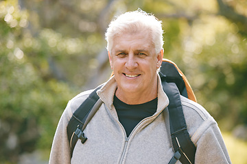 Image showing Hiking, fitness and elderly man in nature for exercise and trekking in the park, vitality and active lifestyle portrait. Senior hiker, travel and adventure with retirement and wellness with cardio.