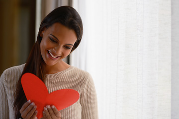 Image showing Heart, love and woman reading card for valentines celebration, mothers day or celebrate special day. Happy, smile and young excited person read red note or romantic holiday cards for romance in home