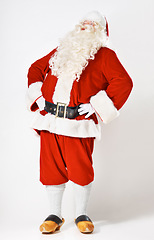 Image showing Christmas, holiday and santa man in suit for festive, happy and cheerful celebration marketing. Traditional santa claus full body with studio mockup and white background for advertising.