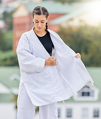 Image showing Karate woman, martial arts uniform and fighter ready for a professional competition tournament with focus, honor and discipline. Judo, sports self defense and fighting motivation in dojo fight event