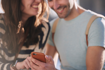 Image showing News, phone and couple networking on social media to share global gossip content for entertainment in a city. Smile, man and happy woman enjoy funny or crazy online conversation on a social network