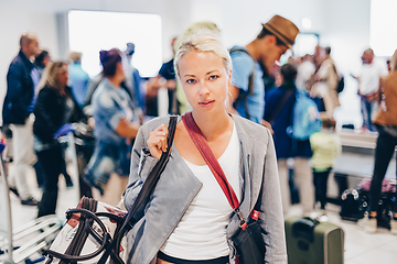 Image showing Female traveller waiting in airport terminal.