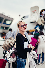 Image showing Woman boarding airplane.