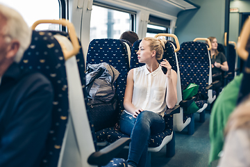 Image showing Woman travelling by train.