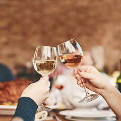 Image showing Hands, wine glass and toast with wine at party, holiday celebration and couple drinking. Dinner party, celebrate together with food, drink and celebrating Christmas, Thanksgiving or anniversary.