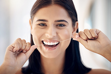 Image showing Floss, oral care and dental with healthy teeth and woman cleaning mouth in portrait, gum health and Invisalign. Hands, face and hygiene with grooming and clean, fresh breath, flossing and whitening.