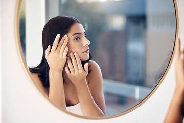 Image showing Skincare, facial and woman by a mirror to check for acne breakout or pimples while cleaning face in bathroom. Beauty, wellness and healthy girl grooming or checking cosmetics results or prp progress