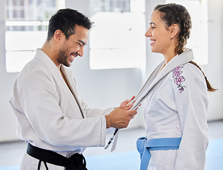 Image showing Karate, belt and martial arts coach happy with fitness, workout and taekwondo student progress. Sports training achievement, ceremony and win of a woman after a fight exercise in a health gym studio