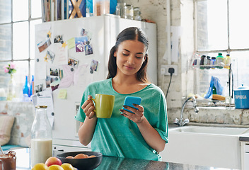 Image showing Phone, coffee or woman in house kitchen for communication or social network on media app in morning. Tea, smile or happy girl on smartphone reading social media news, networking or mobile internet