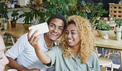 Image showing Black couple, selfie on smartphone and in cafe for love, care and lunch break together. Smile man, laughing woman and happy young people taking photograph in coffee shop, restaurant and social date