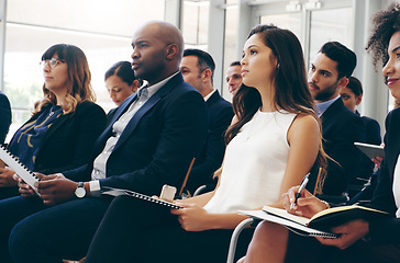 Image showing Business people, conference and audience in workshop training taking notes for team marketing or sales. Employee workers listening to coaching, presentation or meeting seminar for business strategy