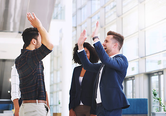 Image showing Success, office and excited business people high five after good business deal, meeting and partnership. Teamwork, collaboration and diversity in corporate workplace with happy workers in celebration