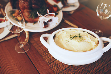 Image showing Food, mashed potatoes and dining table for thanksgiving or Christmas holiday celebration with home cooking for lunch or dinner nutrition. Puree potato, roasted chicken and wine glass background