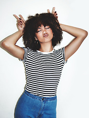 Image showing Peace, fun and fashion with a model black woman in studio on a gray background for contemporary style. Bunny, face and beauty with a female posing inside, pouting her lips with a hand sign or gesture