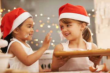 Image showing Children, christmas and baking cookies together for holiday celebration, festive and happy interracial friends. Diversity, friendship and kids smile or young baker for vacation happiness in kitchen