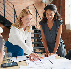 Image showing Blueprint, architecture and women in meeting planning an office building construction with floor plan paperwork. Engineering, real estate or designers writing, pointing and talking about development