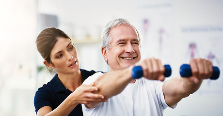 Image showing Physiotherapy, senior man and dumbbell exercise, injury rehabilitation or workout at health clinic. Happy elderly patient, woman physiotherapist or muscle training for strong body, care or fitness