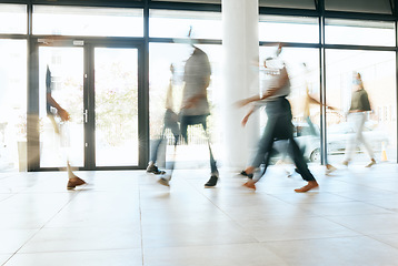 Image showing Motion blur, busy office and business people walking, moving or fast speed in workplace, startup company or agency. Group of workers, crowd and employees rush movement in lobby, building and hallway