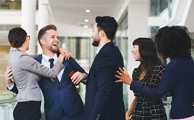 Image showing Business people, hug and friends in social fun together for business success, communication or team building at the office. Group of happy employee workers enjoying team conversation at the workplace