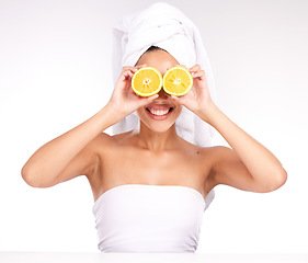 Image showing Beauty, natural skincare and woman with orange fruit eyes for vitamins or healthy lifestyle wellness. Happy model, facial care and body detox or vitamin c cosmetics treatment or citrus dermatology
