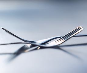 Image showing Metal fork, cutlery and hospitality silverware utensile for catering business or restaurant with togetherness, solidarity and unity on table. Teamwork, life balance and partnership for a food company