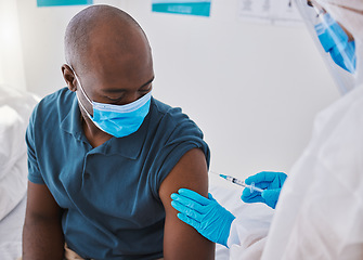 Image showing Vaccine, injection and virus cure for covid, disease and pandemic illness from doctor, healthcare or medical professional. Male patient with mask being injected in arm by hazmat suit frontline worker