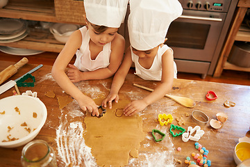 Image showing Family, baking and children learning to shape cookies at a table, development and bond in a kitchen. Cake, cutter and boy kids having fun while making biscuits, playing and being creative with flour