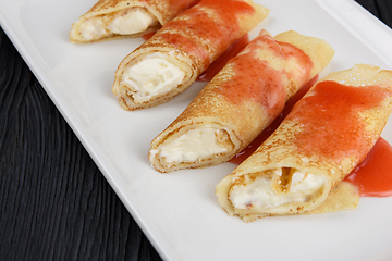 Image showing Pancakes stuffed with cream