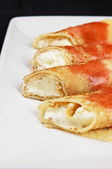 Image showing Pancakes stuffed with cream